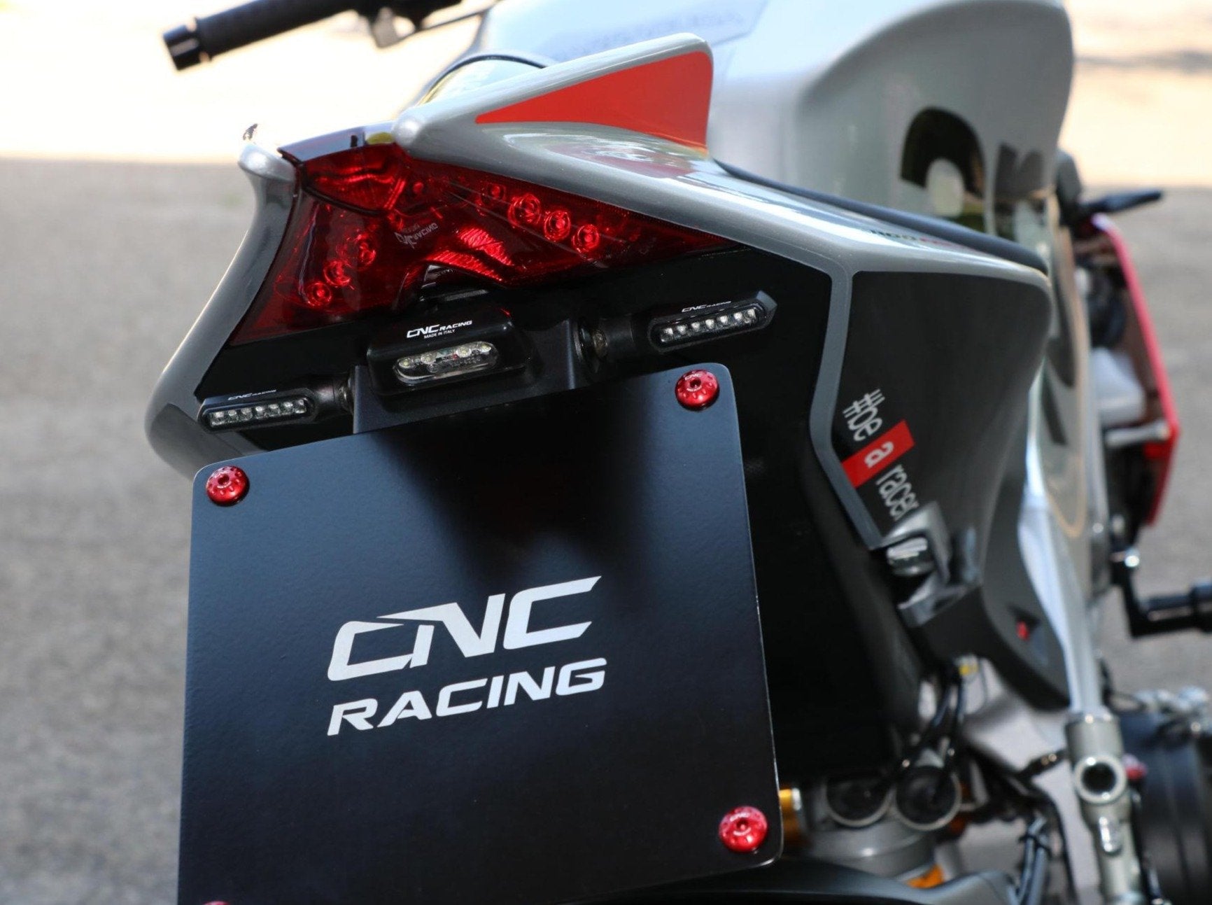 PT103 - CNC RACING Aprilia RSV4 / Tuono V4 (09/20) Adjustable LED License Plate Holder – Accessories in the Motodeal Motorcycle Aftermarket Accessories and Parts Online Shop