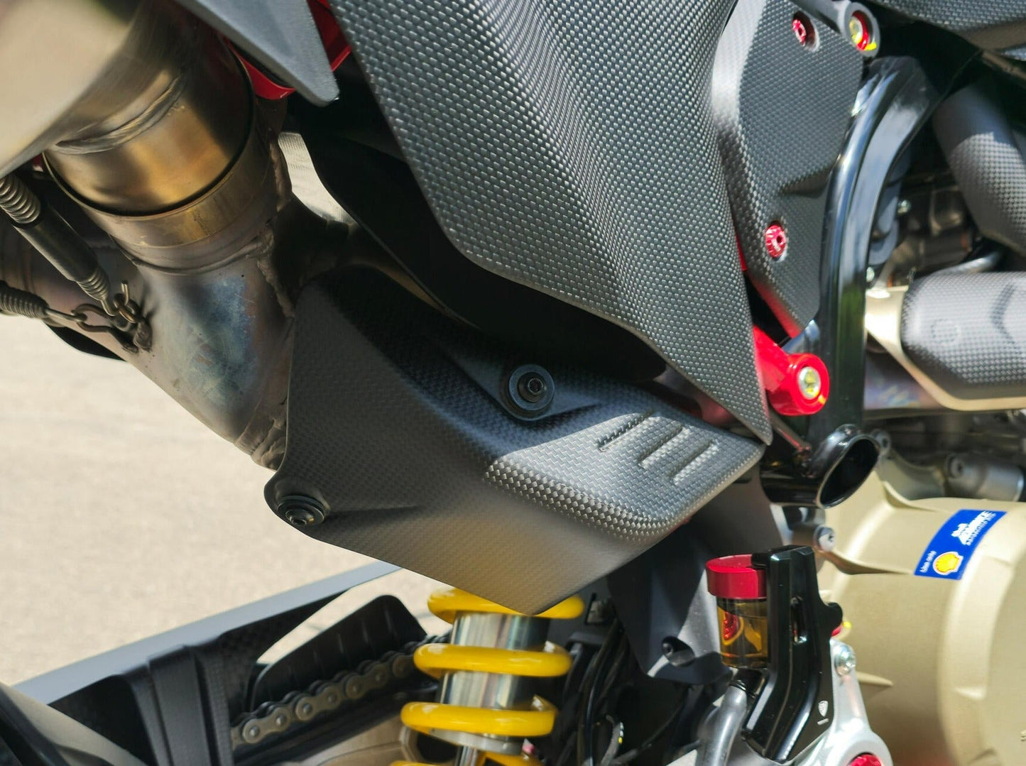 ZA276 - CNC RACING Ducati Hypermotard 698 Mono (2024+) Carbon Exhaust Pipe Rear Heat Guard – Accessories in the Motodeal Motorcycle Aftermarket Accessories and Parts Online Shop